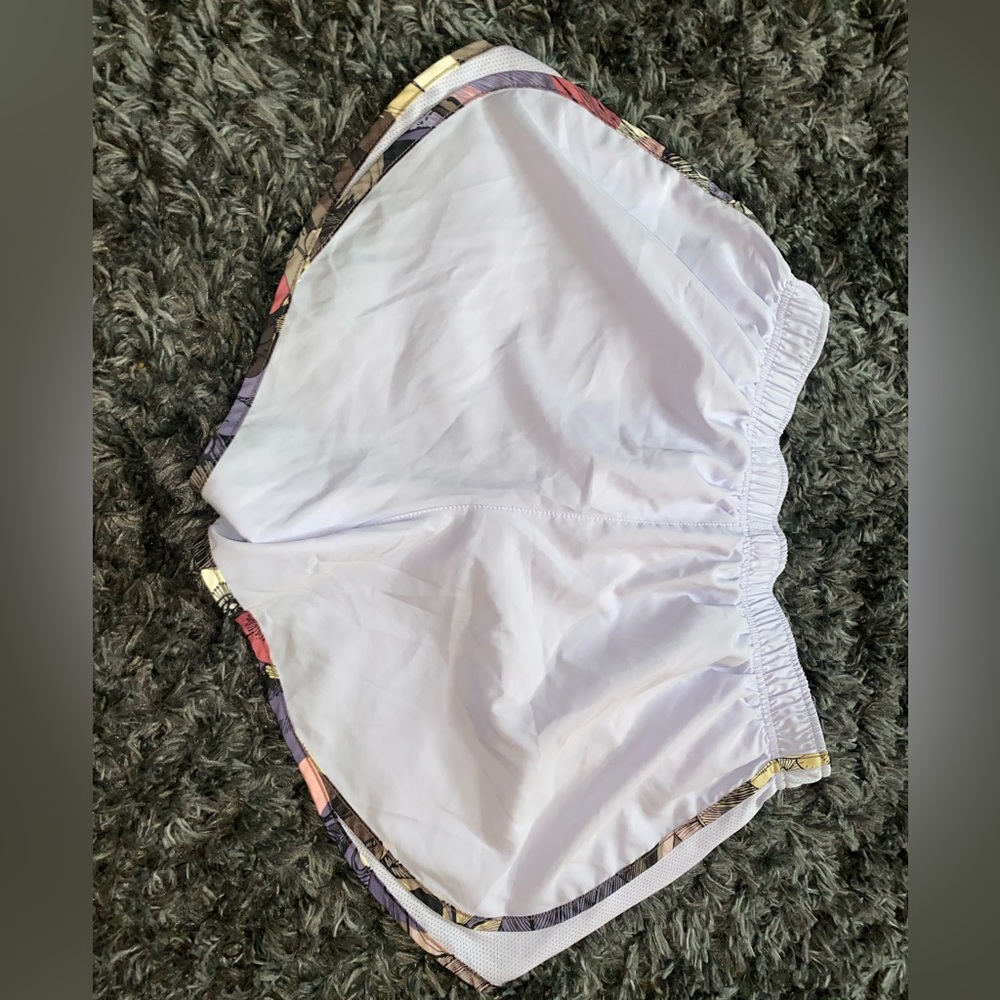 Light purple colored running shorts. Nike size large. Only worn a few times